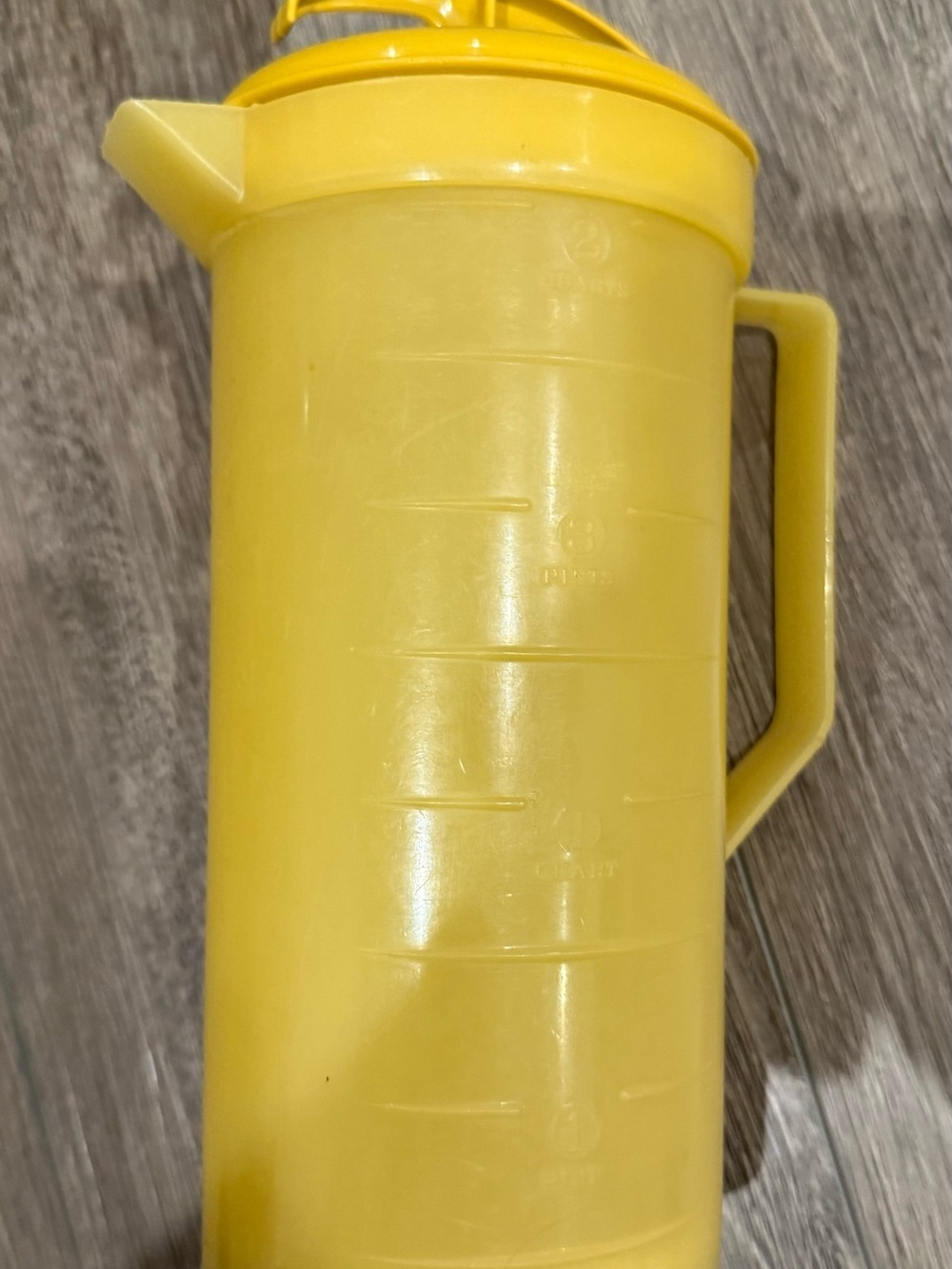 Yellow Plastic Pitcher with Handle and Spout